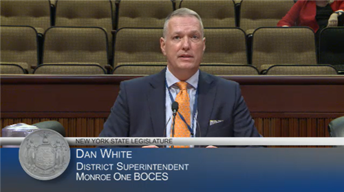 Monroe One BOCES Superintendent Dan White speaks in front of the State Legislature.